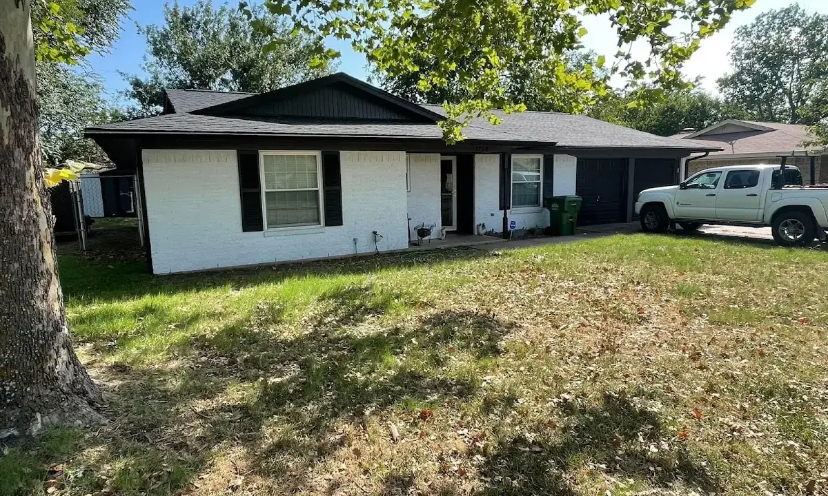 Professional roofing crew working on a residential roof in Ballwin